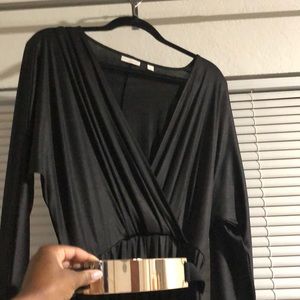 Black jumpsuit with gold accent belt